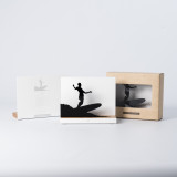 Figure "Surfing · Old-school drop-knee trimming" next to its sleeve and its gift box