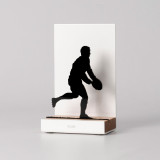 Figure "Rugby · Two-handed pass", angled view showing its oak base
