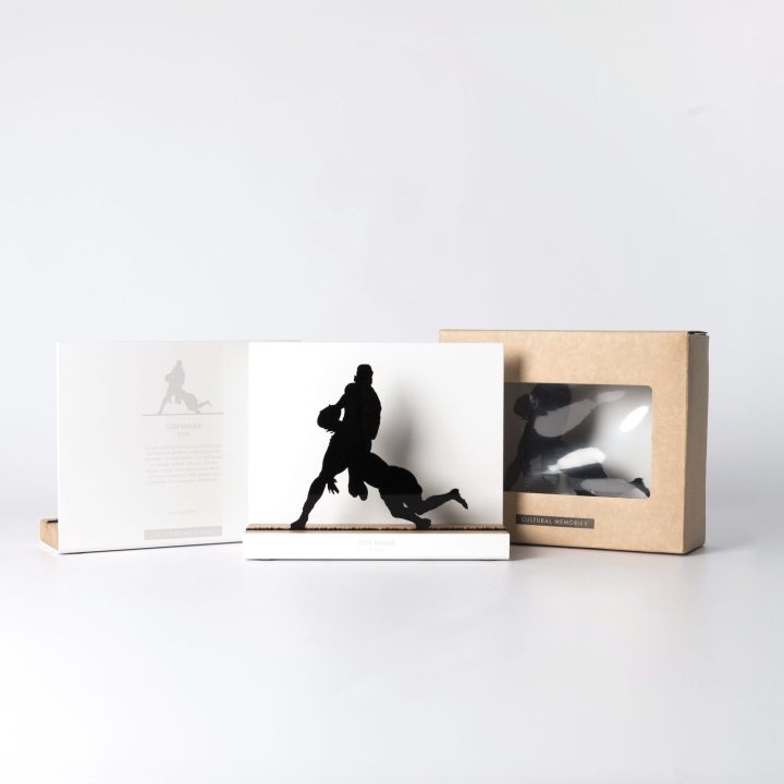 Figure "Rugby · Tackling the ball carrier" next to its sleeve and its gift box