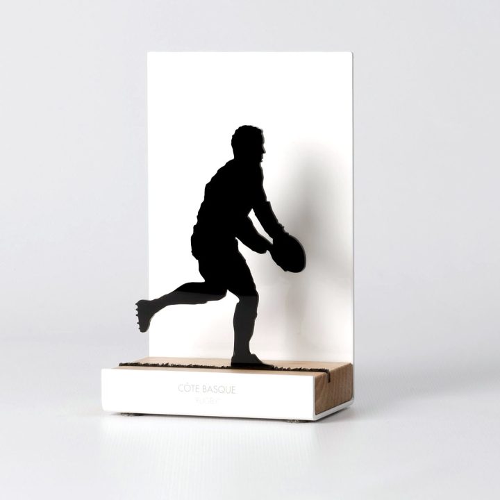 Figure "Rugby · Player about to pass", angled view showing its oak base
