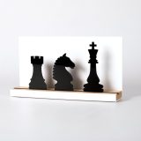 Figure "Chess · Rook, knight and king", angled view showing its oak base