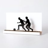 Figure "Football · Race for the ball", angled view showing its oak base
