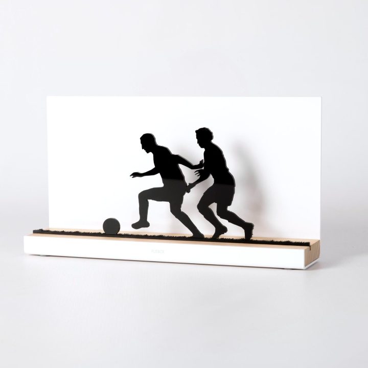 Figure "Football · Race for the ball", angled view showing its oak base