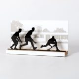 Figure "Field hockey · Three players, sliding tackle", angled view showing its oak base