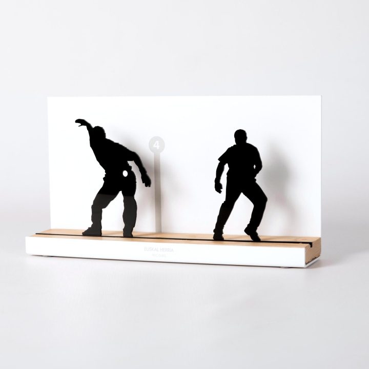 Figure "Basque pelota · Pair of pelotaris on guard", angled view showing its oak base