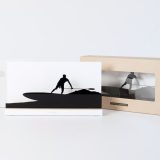 Figure "Paddle surf · Paddling into the wave" next to its sleeve and its gift box