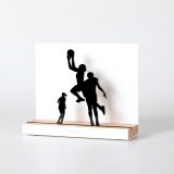 Figure "Basketball · Three players, lay-up against the defence", angled view showing its oak base