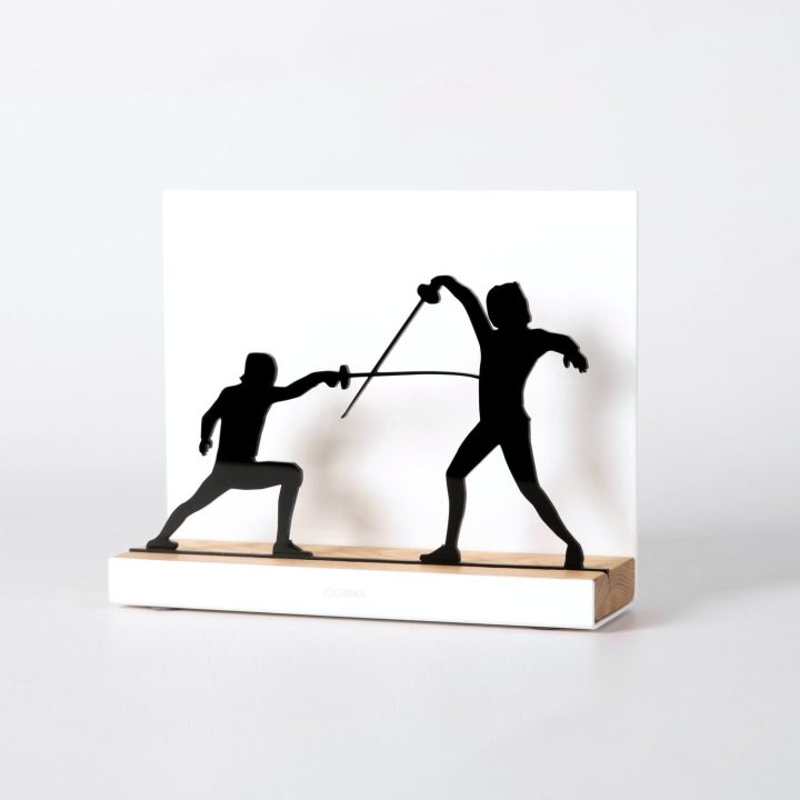 Figure "Fencing · Lunge", angled view showing its oak base