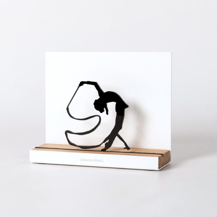 Figure "Rhythmic gymnastics · Back bend with ribbon", angled view showing its oak base