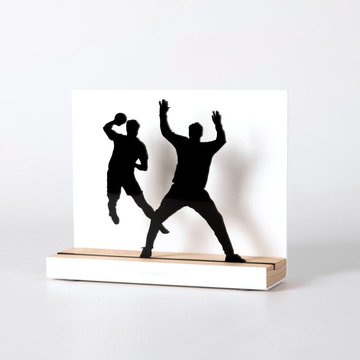 Figure "Handball · Shooter against a defender", angled view showing its oak base