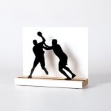 Figure "Handball · Attacker held back", angled view showing its oak base