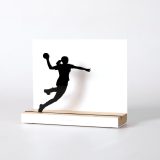 Figure "Handball · Women's jump shot", angled view showing its oak base