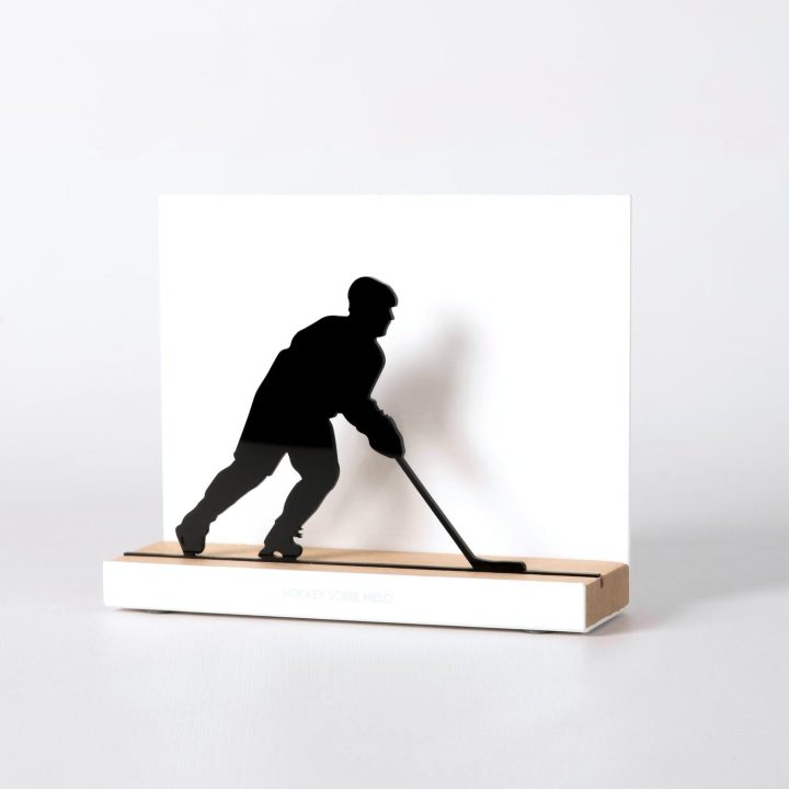Figure "Ice hockey · Player skating", angled view showing its oak base