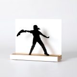 Figure "Jai alai · Woman player throwing with the cesta", angled view showing its oak base