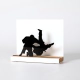 Figure "Judo · Seoi-nage, shoulder throw", angled view showing its oak base