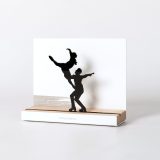 Figure "Figure skating · Pair lift", angled view showing its oak base