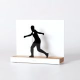 Figure "Basque pelota · Pelotari winding up a volley, hook", angled view showing its oak base