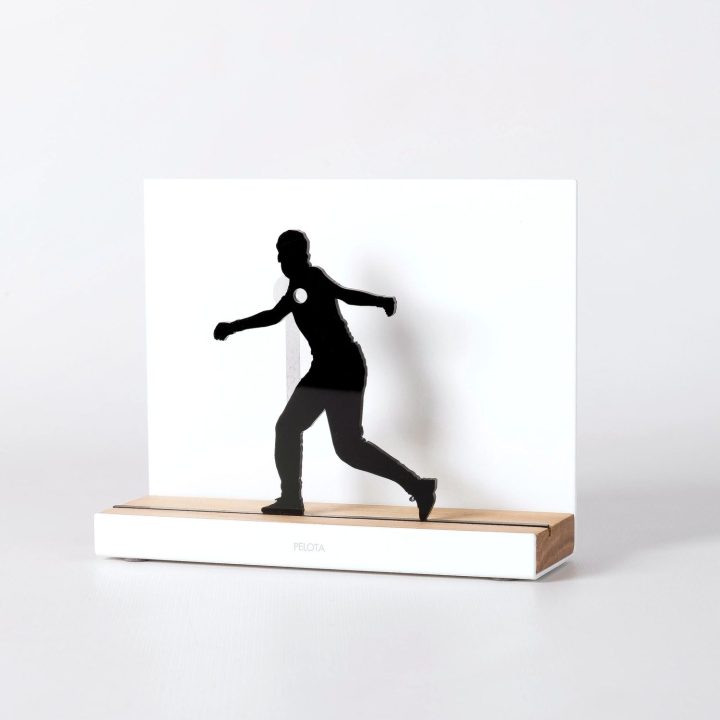 Figure "Basque pelota · Pelotari winding up a volley, hook", angled view showing its oak base