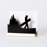 Figure "Snowboard · Board in hand among the pines", angled view showing its oak base