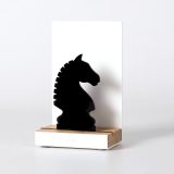 Figure "Chess · Knight", angled view showing its oak base