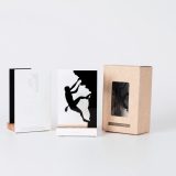 Figure "Climbing · Climber on a rock face" next to its sleeve and its gift box