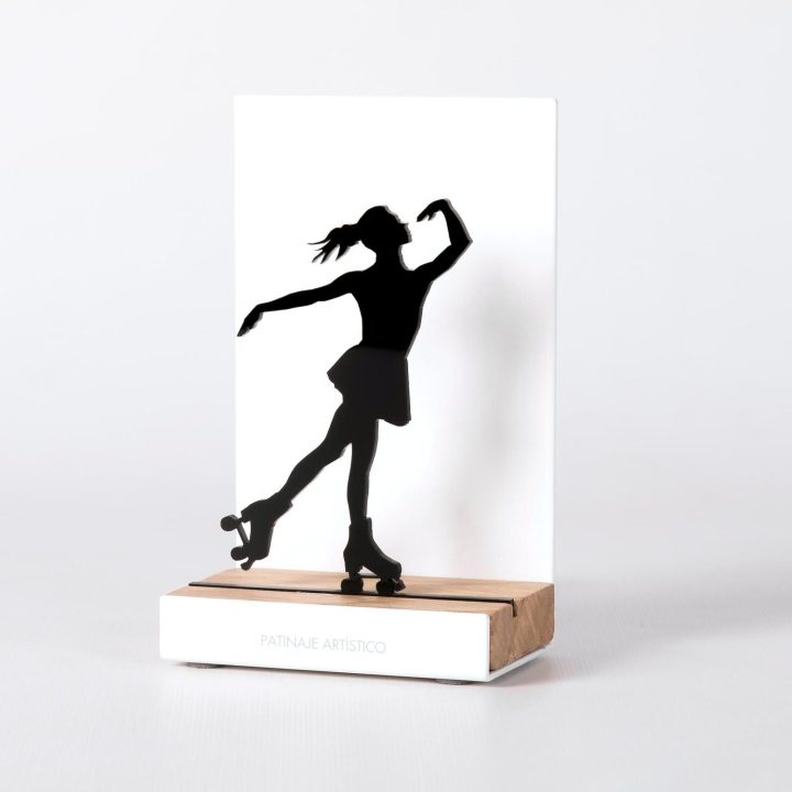 Figure "Skating · Roller skater", angled view showing its oak base