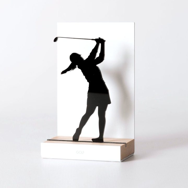 Figure "Golf · Woman golfer's swing", angled view showing its oak base