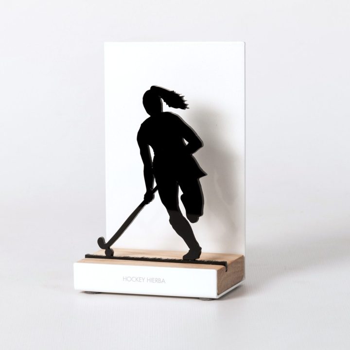 Figure "Field hockey · Ponytailed player", angled view showing its oak base