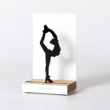 Figure "Figure skating · Biellmann spin", angled view showing its oak base